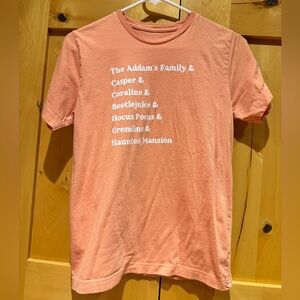 Small Shop Halloween Movie List Graphic Tee - Coral with White Text